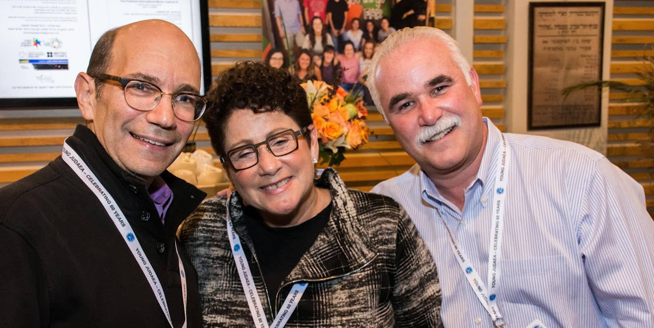 3 attendees at alumni event