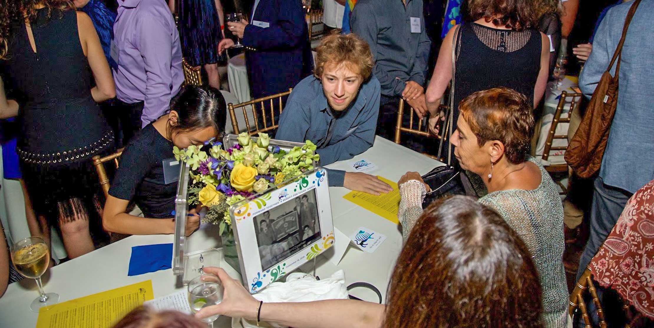 Alumni attendees at event table