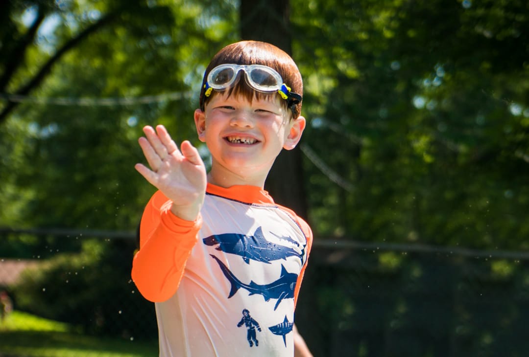 Westchester boy camper waving