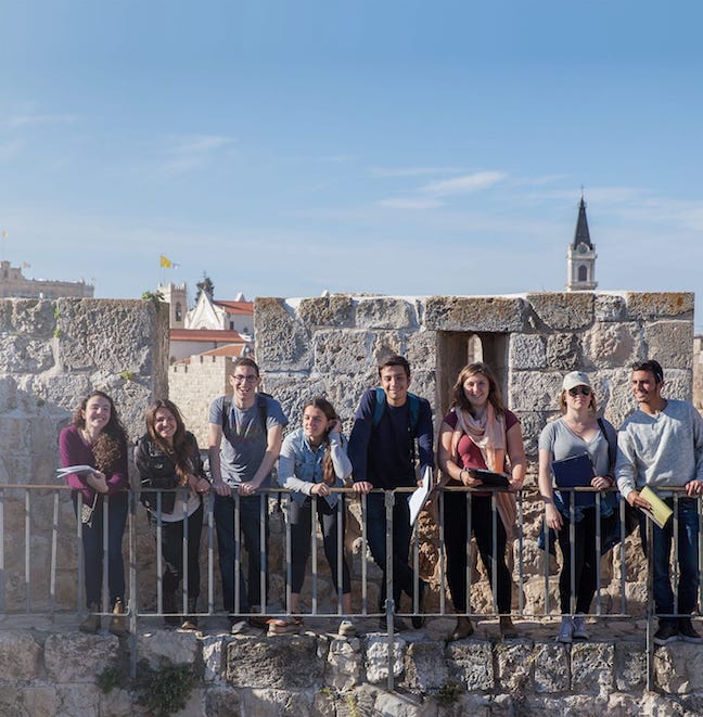 Young men and women on building in Israel